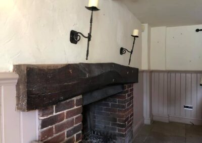 pub fireplace beam restoration before