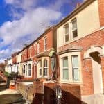 Man Sandblasting a House in Swindon